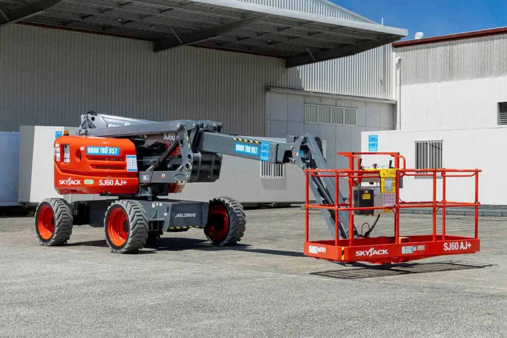 Articulated knuckle boom lift ready to be used safely on an industrial worksite in New Zealand