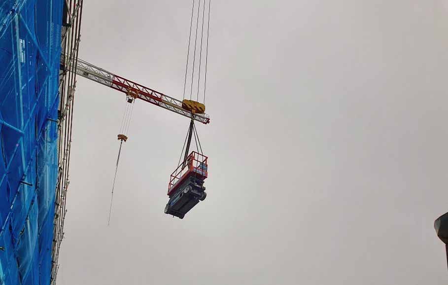 SKYJACK3226 8m Electric Scissor lift being lifted by crane to site