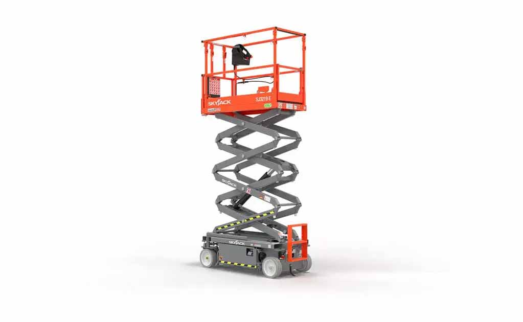Compact electric mini scissor lift raised indoors for maintenance and installation work